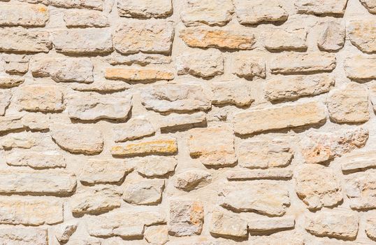 Rustic old stone wall texture background structure