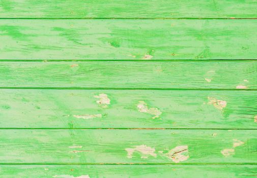 Rustic green colored wooden planks background texture with copy space