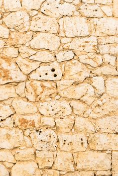 Rustic brown stone wall texture background structure