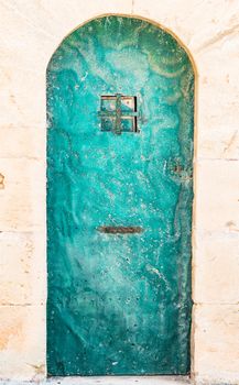 Detail view of ancient metal door, closed