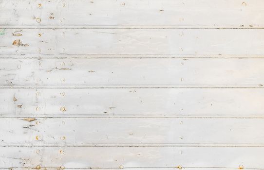 Old white painted wooden planks for background texture