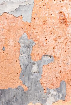 Close-up of peeling plaster wall background texture
