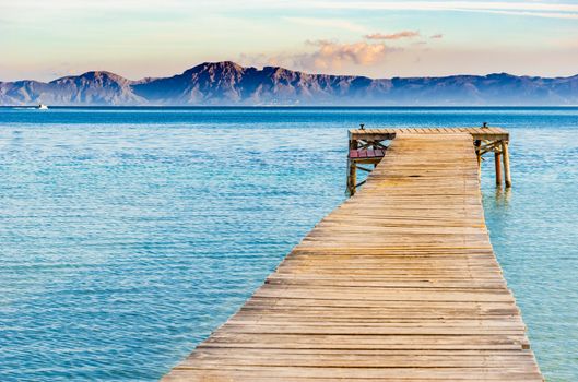 Jetty at the bay of Alcudia on Mallorca island, Spain Mediterranean Sea