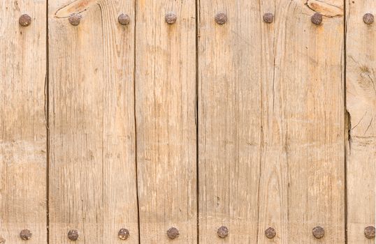 Old wooden boards backdrop texture, framed with rusty nails