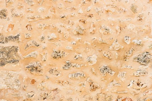 Rustic old plastered stone wall texture background structure