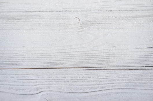 Empty white wooden table background texture, top view

