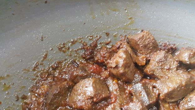 A close up view of Stewed chicken liver withspices  on it, a traditional home made delicious liver dish