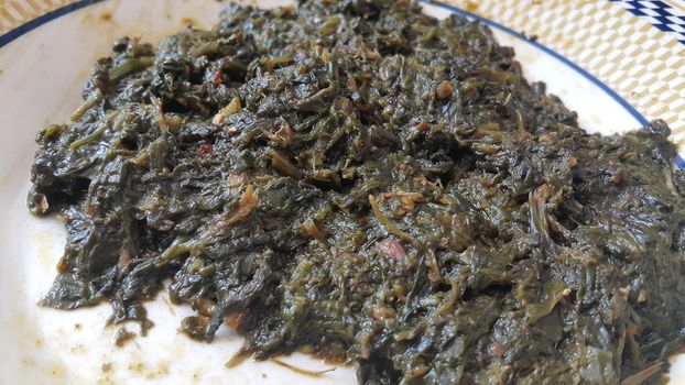 Close up view of delicious traditional fresh spinach leaves or vegetables cooked dish, delicious food also called paalak saag, food background for text
