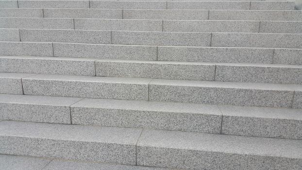 Closeup vire of grey concrete stairs with dark concrete lines on footsteps