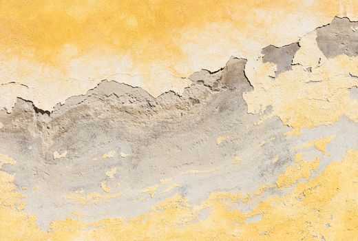 Close-up of damaged wall plaster background texture