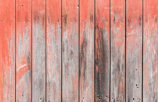Old weathered red painted wooden planks background texture