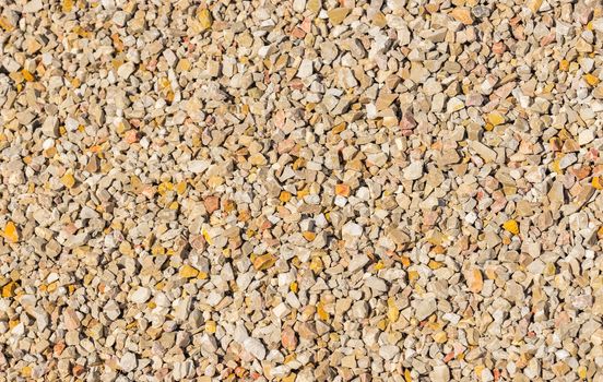 Close-up of small fine gray gravel background texture