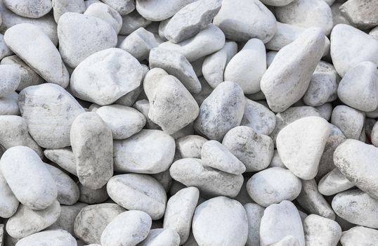 Close-up of white pepples stones background texture