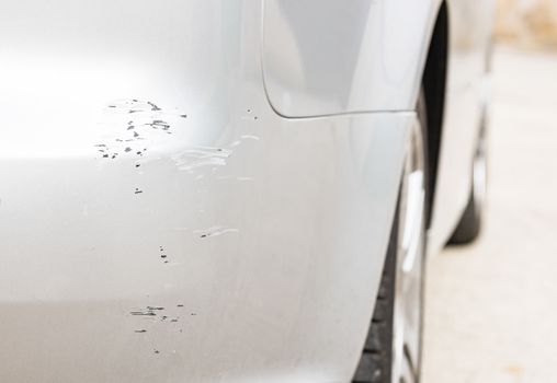Car accident with close-up of scratched bumper