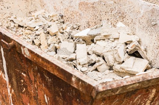 Close-up of container with building rubble