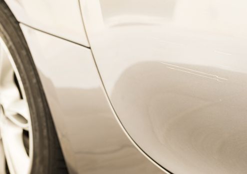 Car accident with close-up of damaged bumper 
