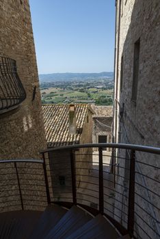 assisi,italy july 11 2020 :architecture of streets and buildings in the historic center of assisi