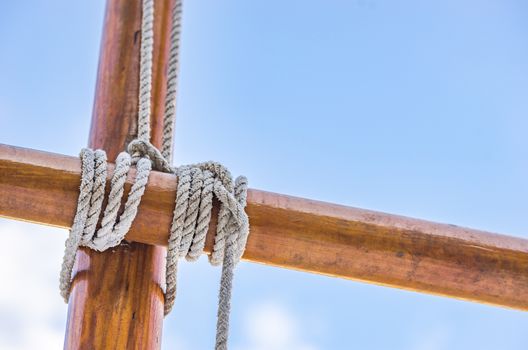 Detail view of rigging on wooden mast