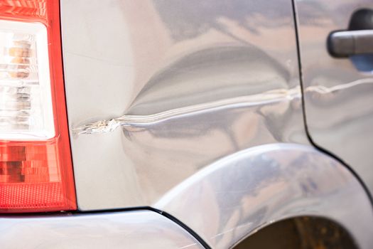 Car crash with detail view of damaged car body