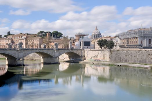 Saint Peter Basilica in the Vatican, from across the Tiber river bridge of Sant Angelo
