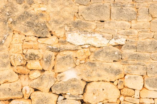 Grunge damaged stone wall background texture, close-up