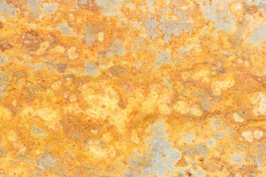 Slate mineral stone background stained golden colored