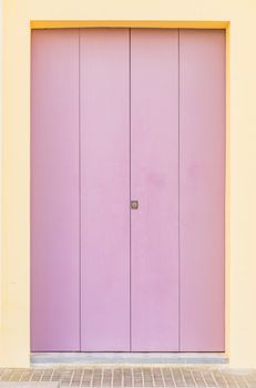 Lilac colored wooden front door of house entrance 



background 