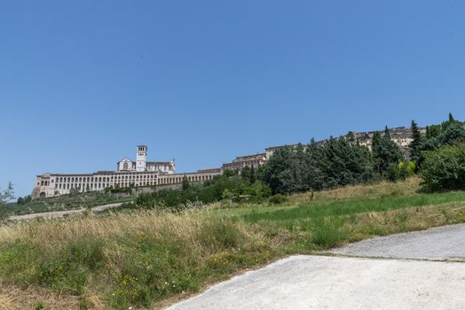 assisi,italy july 11 2020 :landscape of assisi seen from outside the country