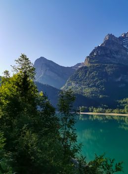 Swiss mountains and Lake. Scenic Alps and lane view. Trekking and outdoor lifestyle