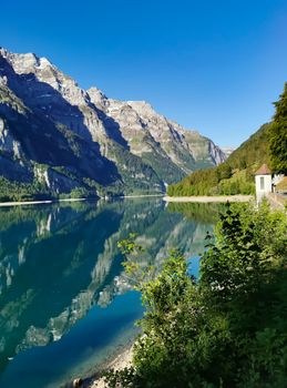 Swiss mountains and Lake. Scenic Alps and lane view. Trekking and outdoor lifestyle