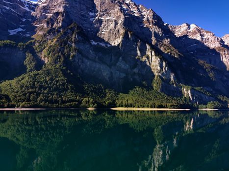 Swiss mountains and Lake. Scenic Alps and lane view. Trekking and outdoor lifestyle