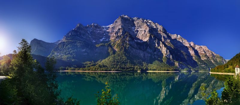 Swiss mountains and Lake. Scenic Alps and lane view. Trekking and outdoor lifestyle