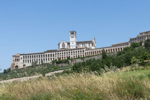 assisi,italy july 11 2020 :landscape of assisi seen from outside the country