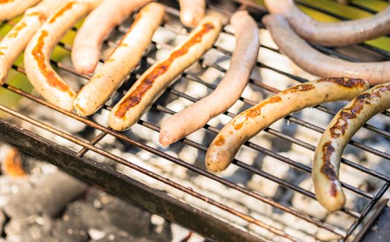 Close-up of grilled sausages on barbecue grill