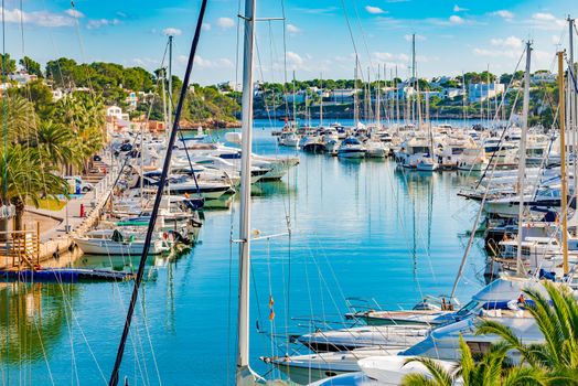 Luxury boats moored at the marina of Cala Dor on Mallorca, Spain Balearic islands