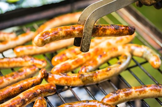 Close-up of grilled sausages on barbecue grill