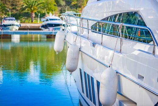 Luxury motor boat anchoring at harbor