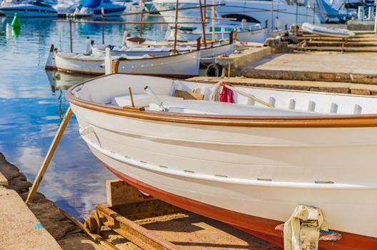 View of traditional wooden fishing boats at harbour