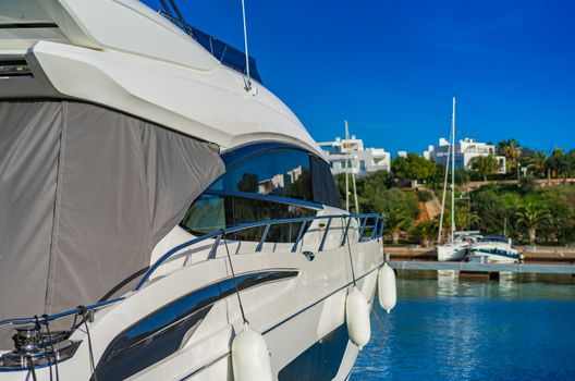 Luxury motor yacht moored at marina in Cala Dor on Mallorca, Spain Balearic islands