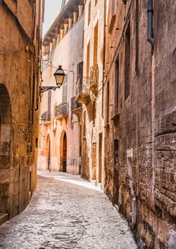 Narrow street at the old town of Palma de Majorca, Spain Balearic Islands