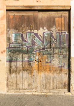View of old graffiti paint on wooden door