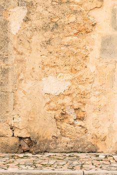 Vintage dirty wall background texture with pavement and copy space