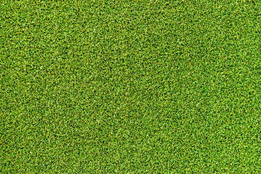 Close-up of green artificial grass background texture