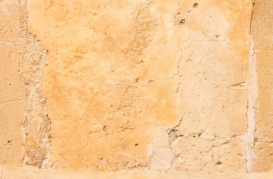 Vintage colored wall background with rustic weathered plaster texture 