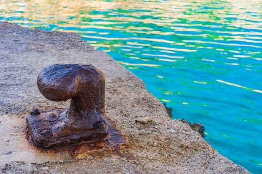 Detail view of an old mooring bollard