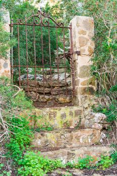 Idyllic view of old rusty iron garden door