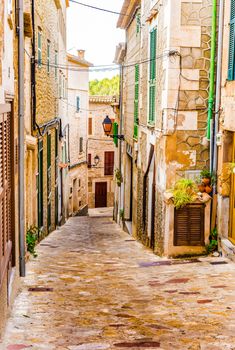 Idyllic old mediterranean village with narrow alley way 
