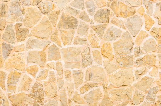 Pattern of natural stone wall background texture, close-up