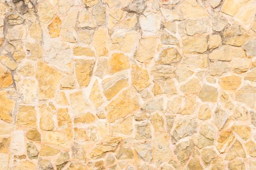 Old weathered stone wall background texture, structure close-up