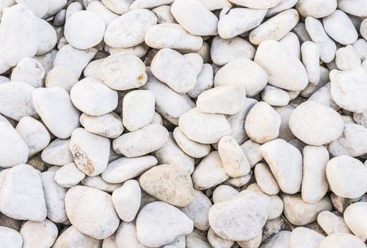 Close-up of white pepples stones background texture